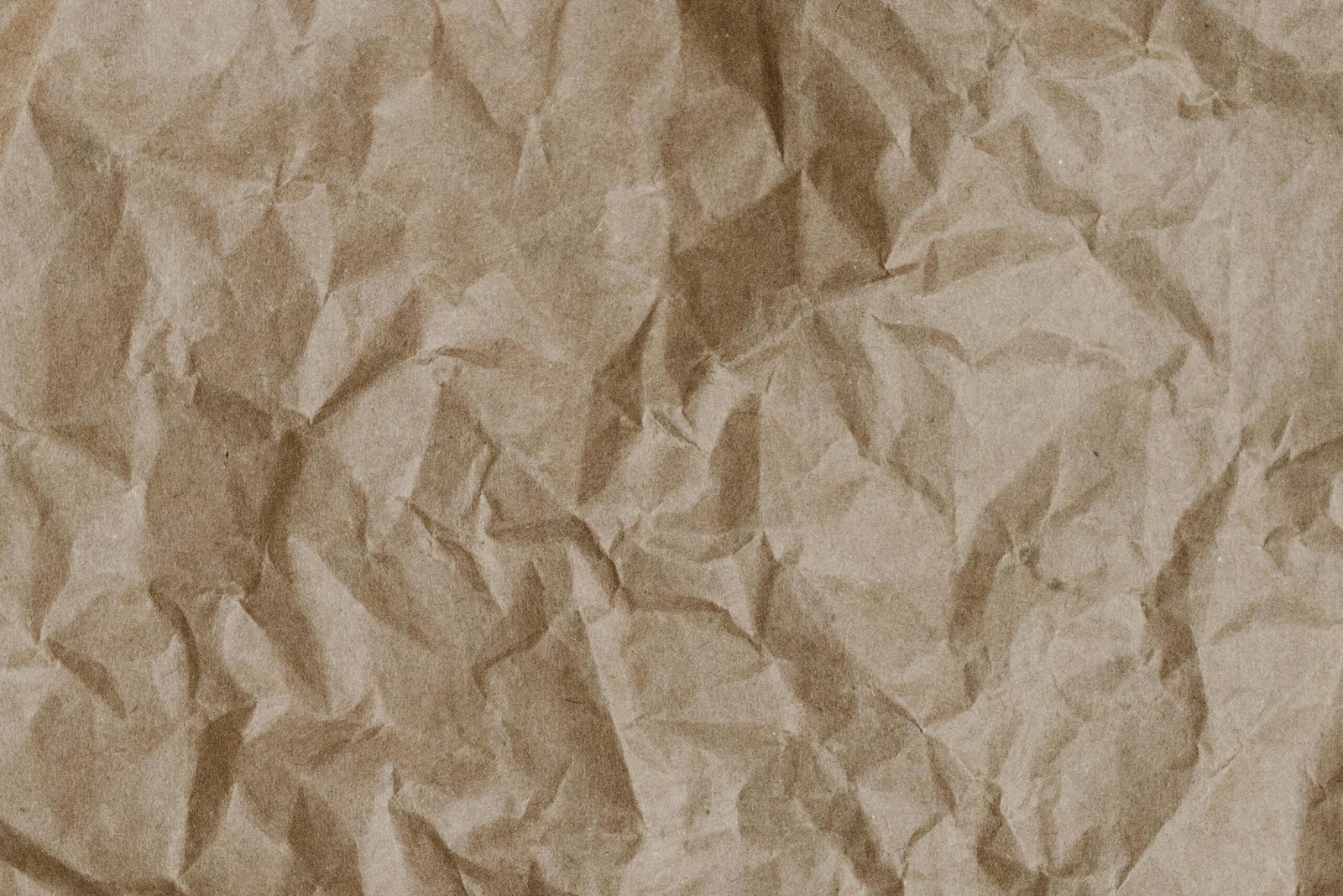 Abstract texture of crumpled craft paper, ideal for design and background use.